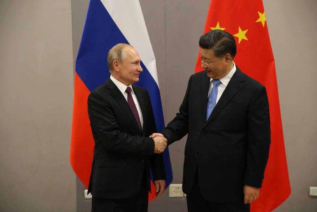 Russian President Vladimir Putin meets Chinese President Xi Jinping at BRICS Summit in Brasilia