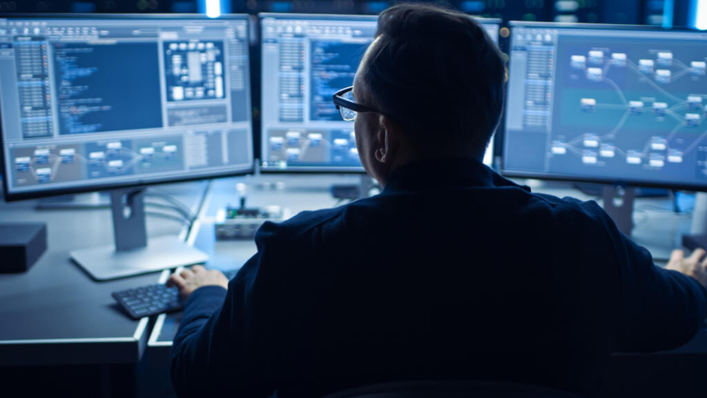 Professional,It,Programer,Working,In,Data,Center,On,Desktop,Computer