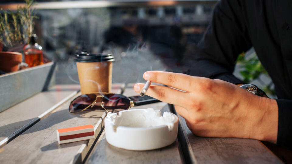 Close,Up,Of,Man's,Hands,Hold,Cigarette,In,Hand.,He