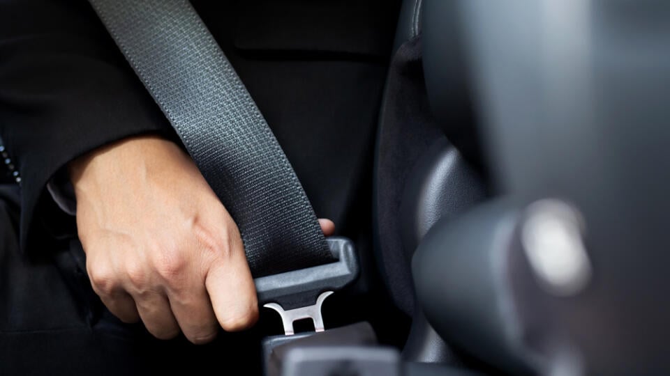 Close,Up,Of,People,Business,Man,Hand,Fastening,Seat,Safety