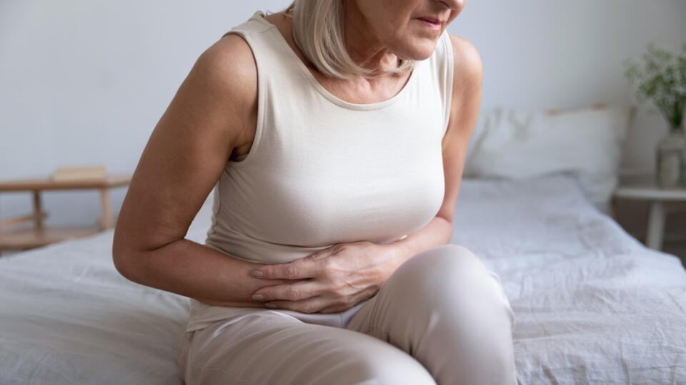 Cropped,Image,Older,Unhealthy,Woman,Embracing,Belly,,Suffering,From,Strong