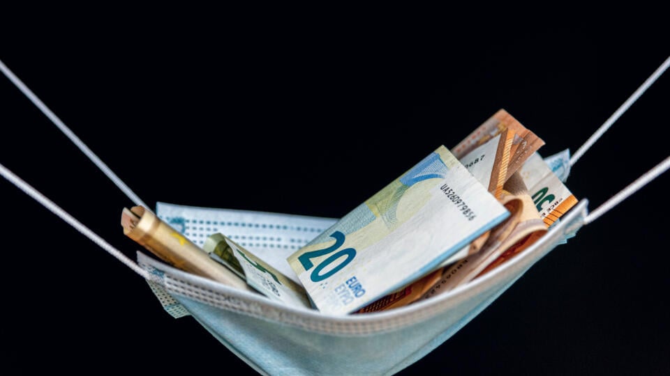 Medical,Face,Mask,And,Money,On,A,Black,Background.,World