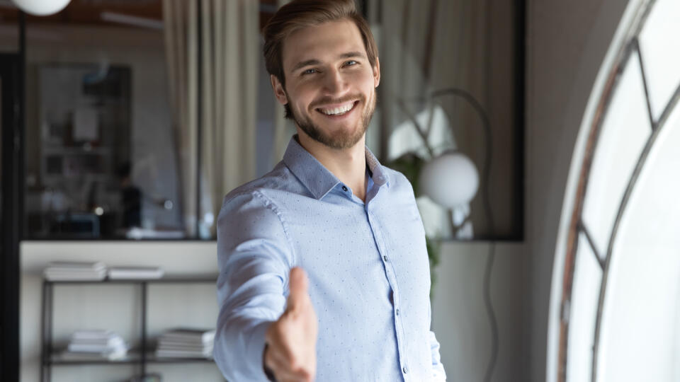 Portrait,Of,Happy,Young,Male,Hr,Stretching,Hand,Inviting,You