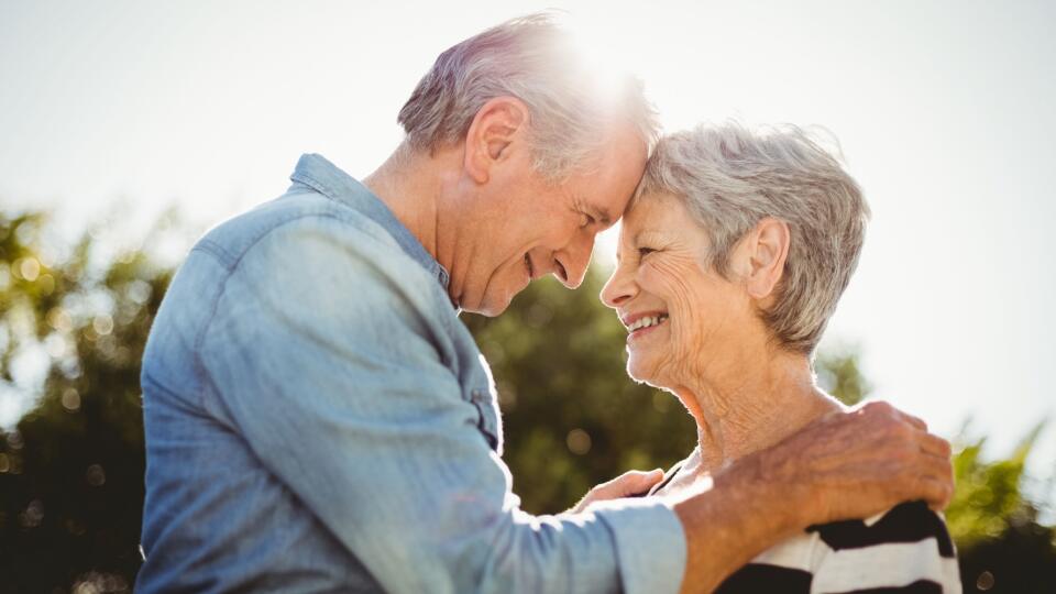 Side view of romantic senior couple looking at each other