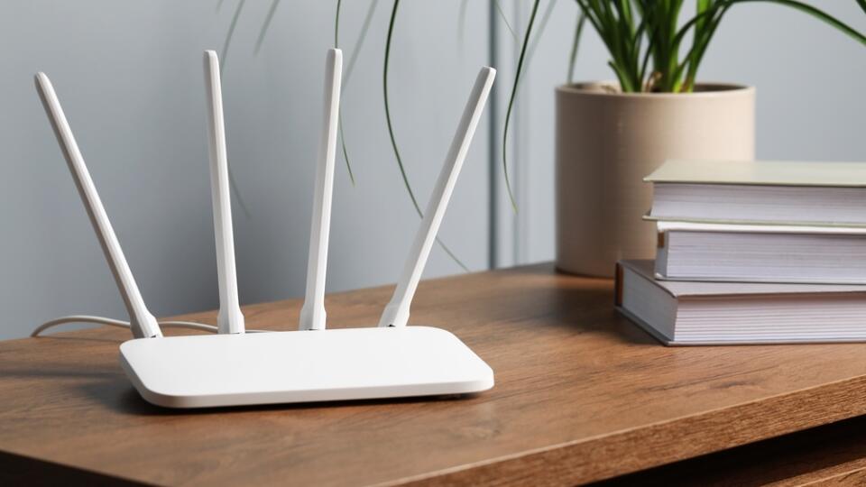 New,White,Wi-fi,Router,On,Wooden,Table,Indoors