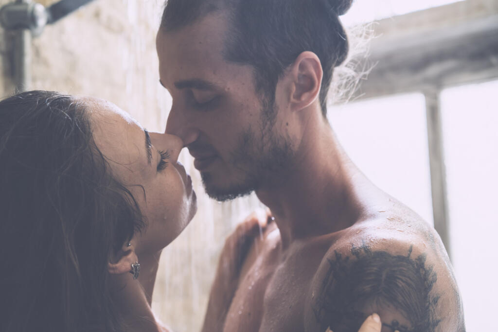 Young,Couple,Enjoying,Each,Other,In,The,Shower