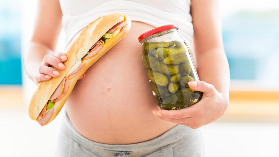 Pregnant,Woman,With,Sandwich,And,Jar,Of,Pickles