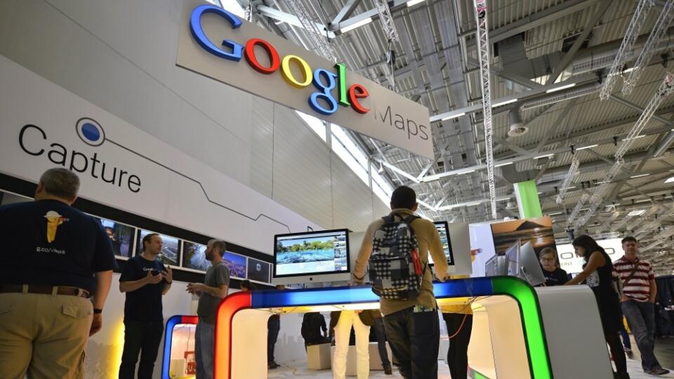 Visitors are testing Google maps products during the photo fair Photokina in Cologne, Germany, Thursday, Sept. 18, 2014. One of the largest fairs for imaging is open until Sept. 21, 2014. (AP Photo/Martin Meissner)
