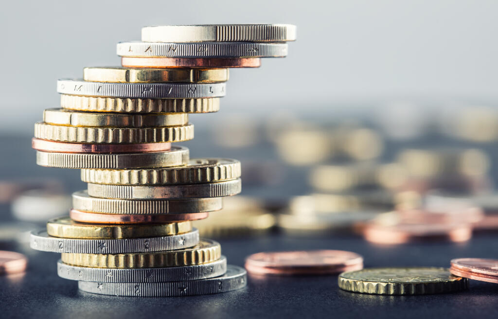 Euro,Coins,Stacked,On,Each,Other,In,Different,Positions.
