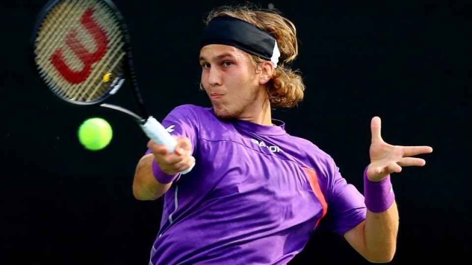 WA 2 Atlanta - Slovenský tenista Lukáš Lacko odvracia úder šiesteho nasadeného Uzbeka Denisa Istomina v 2. kole mužskej dvojhry na tenisovom turnaji ATP v Atlante 23. júla 2014. V druhom kole vyhral Lacko s Uzbekom Istominom po trojsetovej bitke 5:7, 6:1, 6:4 a po druhý raz v kariére sa prebojoval do štvrťfinále dvojhry na turnaji ATP v Atlante. FOTO TASR /AP
Lukas Lacko, of Slovakia, returns a shot to Denis Istomin at the BB&T Atlanta Open on Wednesday, July 23, 2014, in Atlanta. (AP Photo/