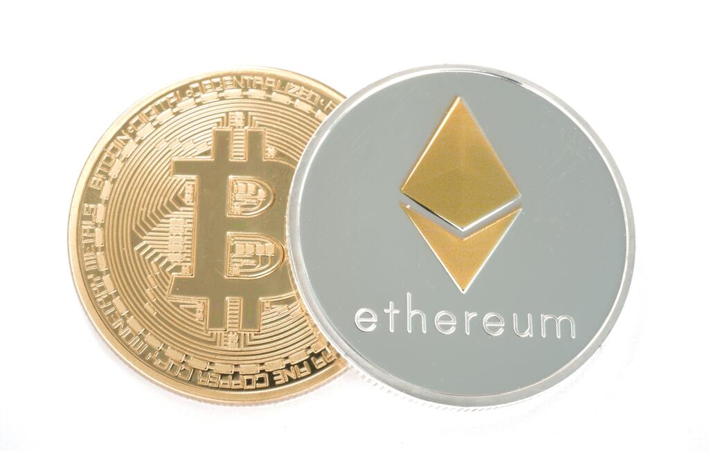 Real coin of cryptocurrency Silver Ethereum and golden bitcoinisolated on white background
