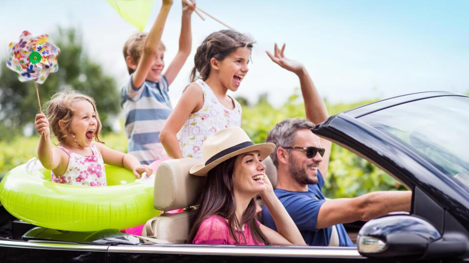 A,Joyful,Family,,In,A,Convertible,Car,,Goes,On,Holiday