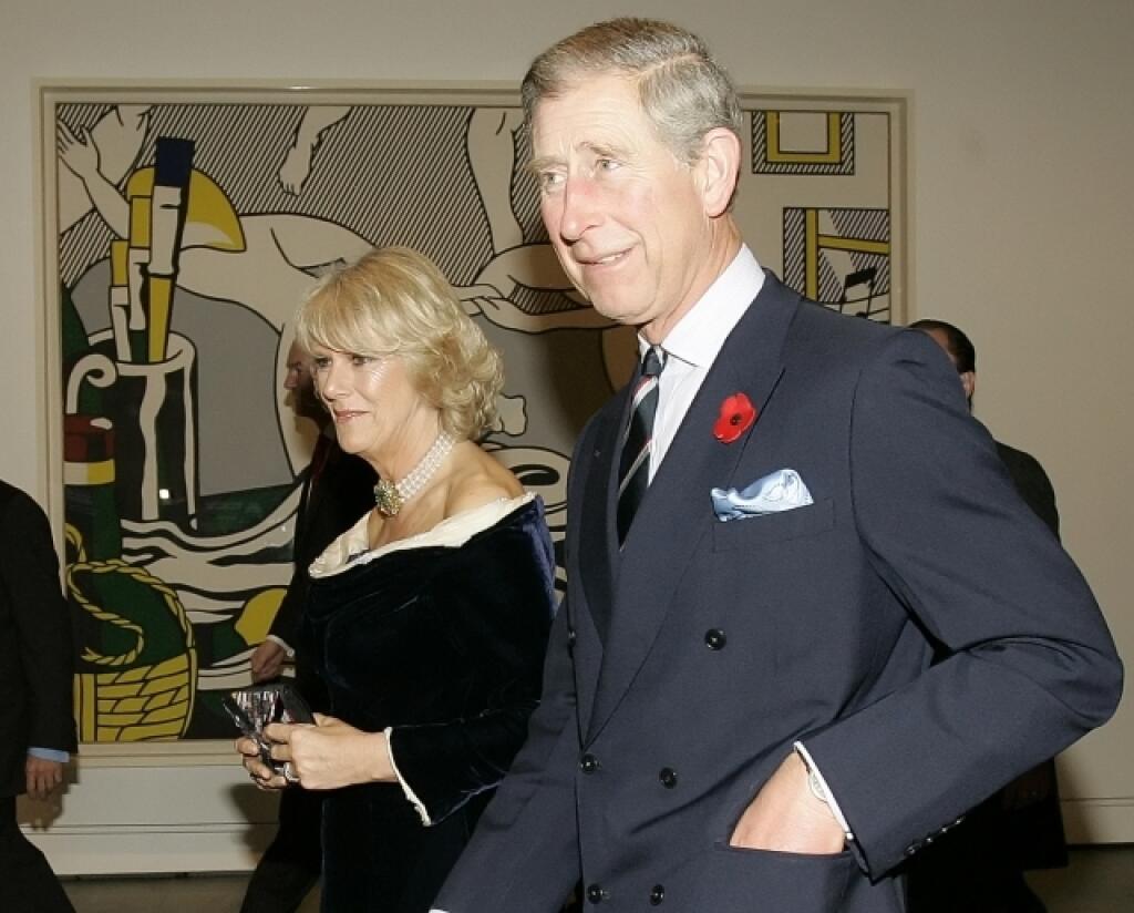 Britain's Prince Charles and Camilla, Duchess of Cornwall pass a painting by Roy Lichtenstein at the Modern Art Museum in New York Tuesday, Nov. 1, 2005. (AP Photo/Gregory Bull)