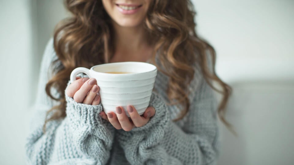 Woman,In,A,Sweater,Drinking,Tea