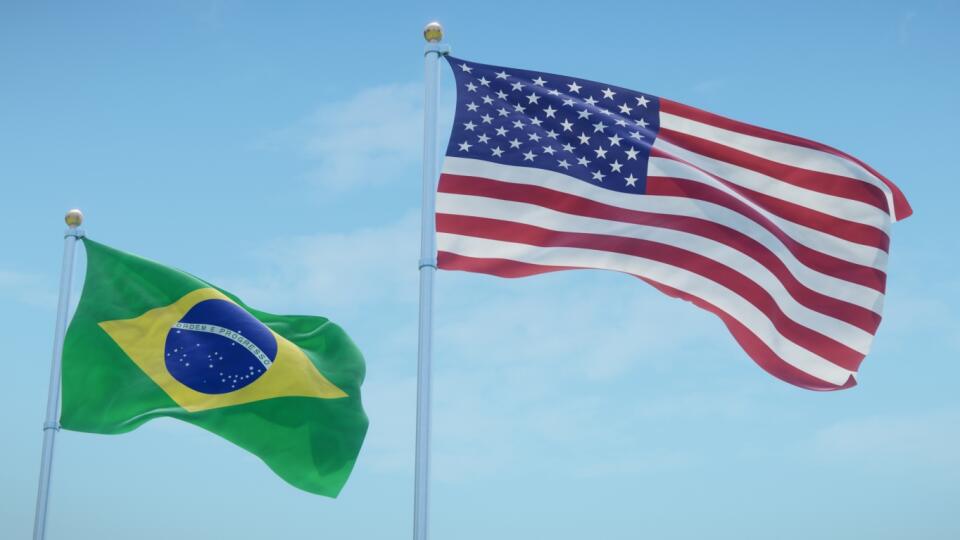 Flags,Of,Brazil,And,The,Usa,Against,Blue,Sky,Backdrop.