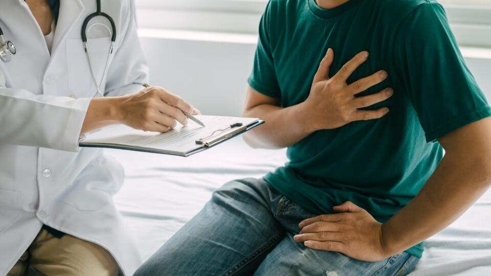 Male,Patient,Consulting,A,Medical,Specialist,At,Hospital.,Chest,Pain