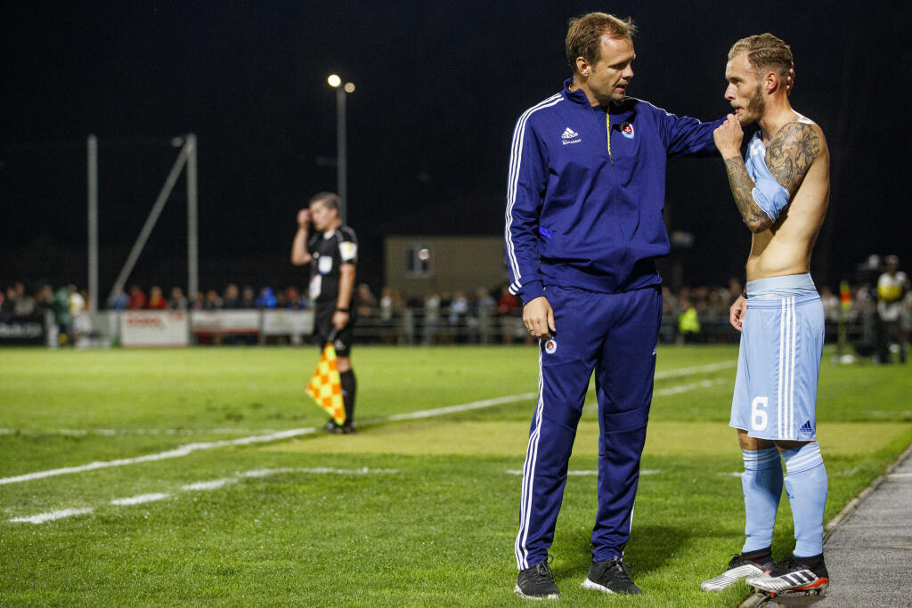 Na snímke Vladimir Radenkovič a Joeri De Kamps počas zápasu 1.kola Fortuna Ligy medzi nováčikom FK Pohronie a úradujúcim majstrom ŠK Slovan Bratislava.