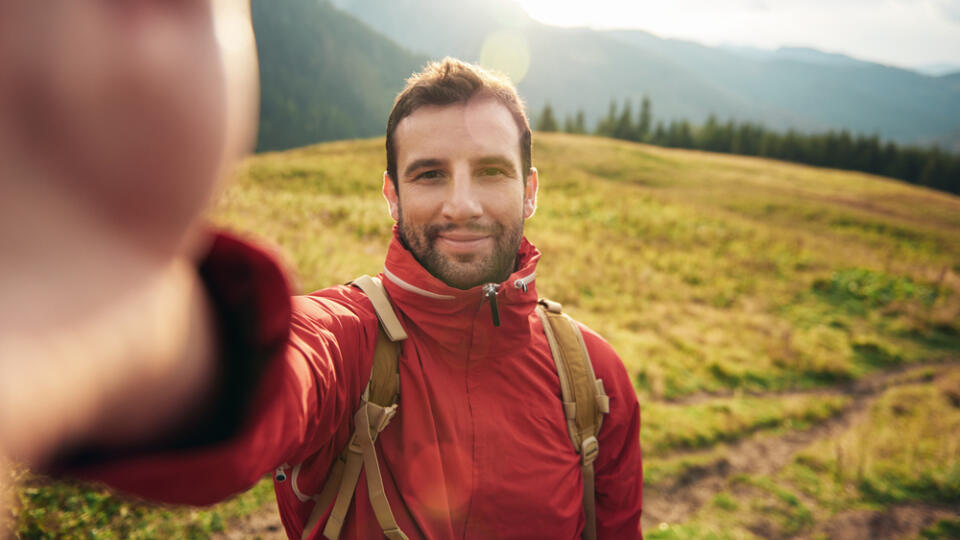 Hiker,Taking,A,Selfie,While,Out,Trekking,In,The,Wilderness