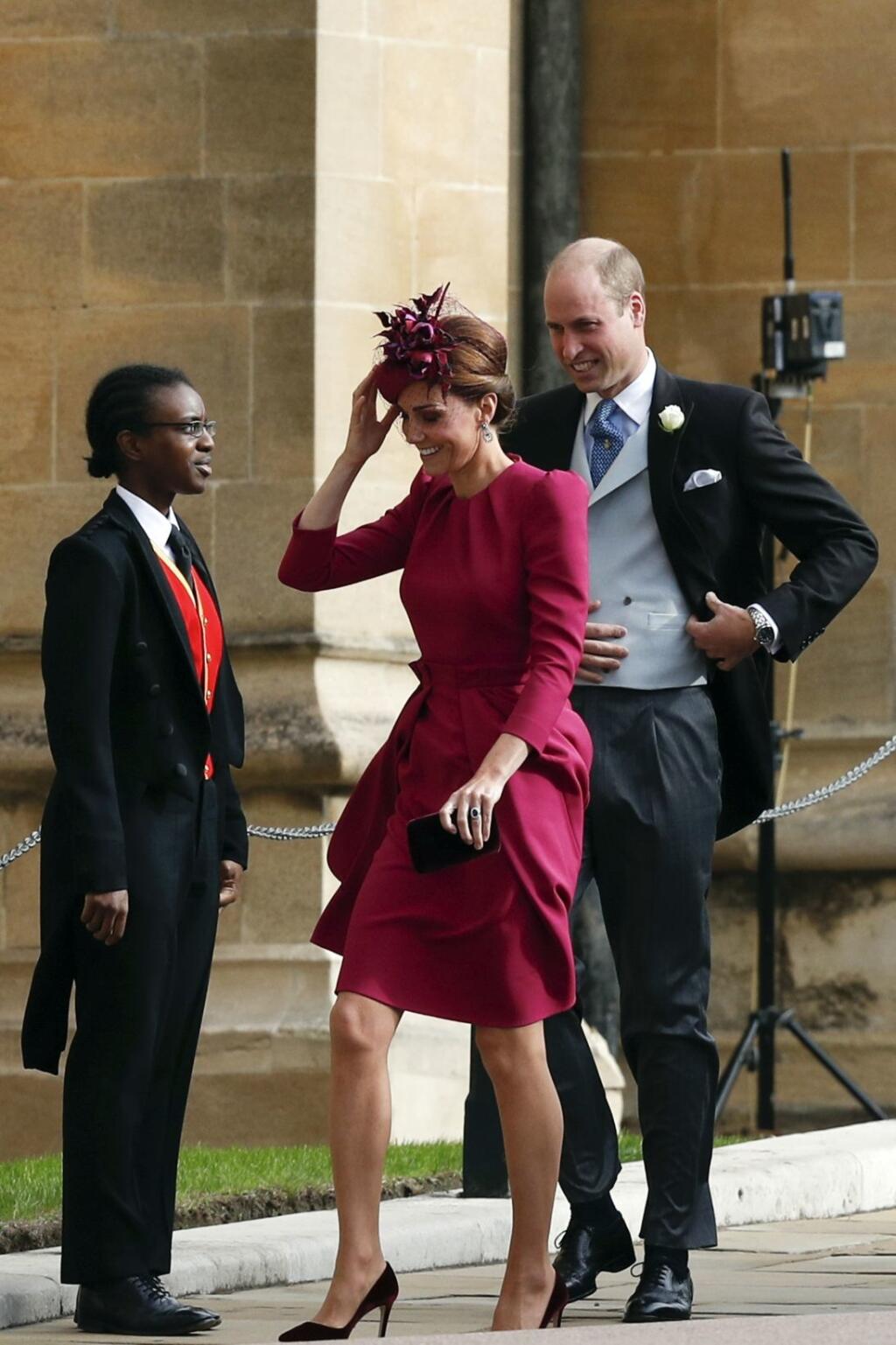 Britain's Prince William and Kate, Duchess of Cambridge arrive to attend the wedding of Princess Eugenie of York and Jack Brooksbank at St George’s Chapel, Windsor Castle, near London, England, Friday Oct. 12, 2018. (Adrian Dennis/Pool via AP)