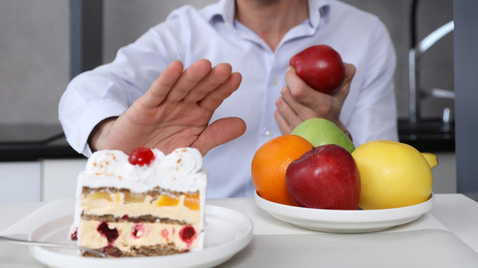 Man,Refuses,To,Eat,Unhealthy,Cake,And,Choose,Fruits,For