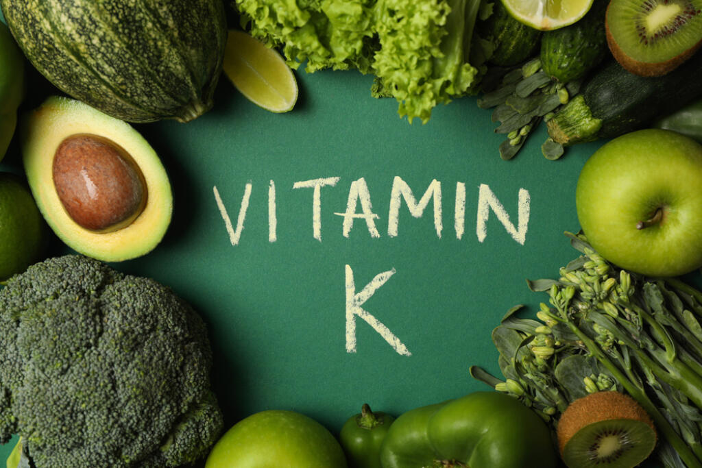 Vegetables,,Fruits,And,Text,Vitamin,K,On,Green,Background