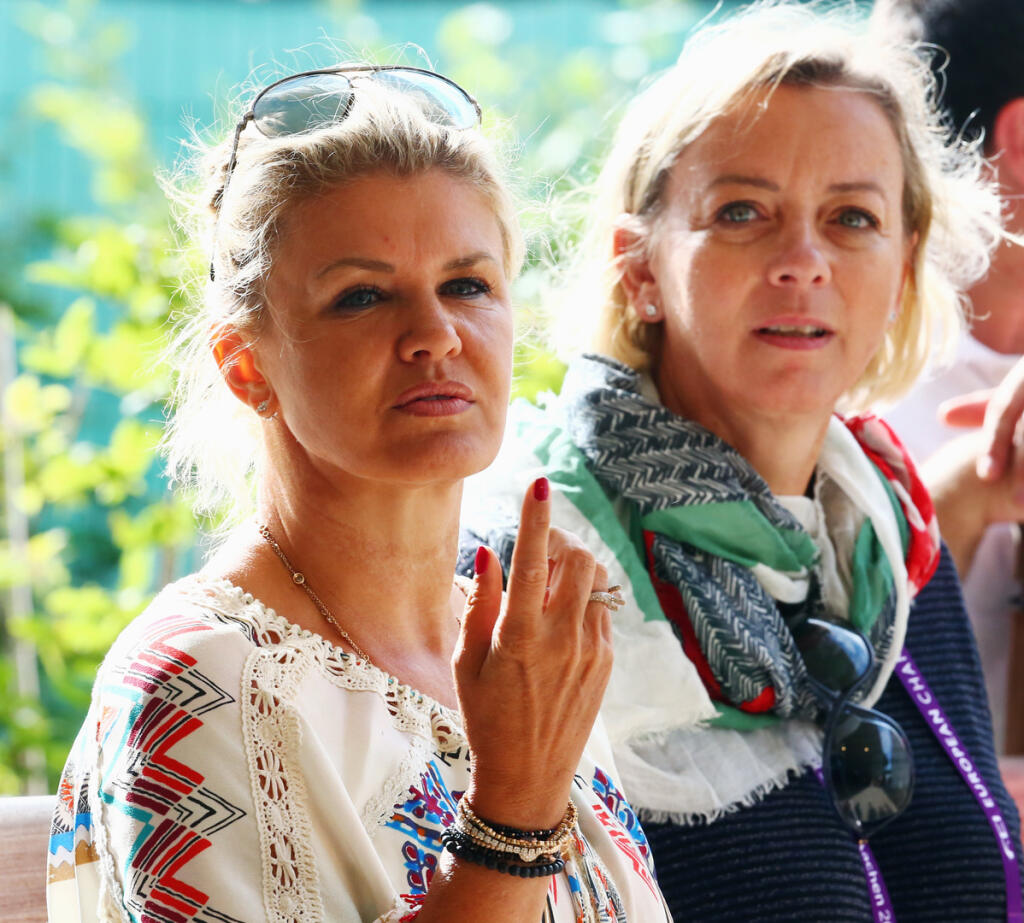 AACHEN, GERMANY - AUGUST 14: Corinna Schumacher, wife of former German Formula One driver Michael Schumacher, watches their daughter Gina present the elements of the reining competition with manager Sabine Kehm during Day 3 of the FEI European Equestrian Championship 2015 on August 14, 2015 in Aachen, Germany. (Photo by Alex Grimm/Bongarts/Getty Images)