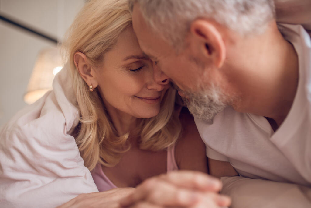 Happy,Morning.,Middle-aged,Couple,Having,Romantic,Moment,In,Bedroom