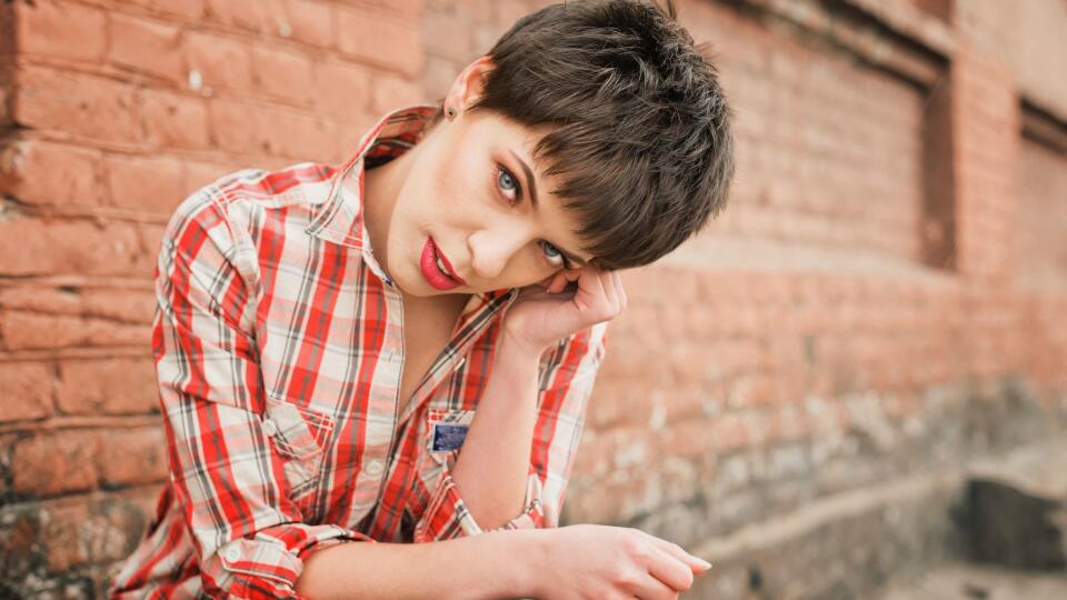 Outdoor portrait of young woman with short Hair