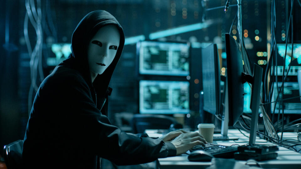 Masked,Hacker,Is,Using,Computer,For,Organizing,Massive,Data,Breach