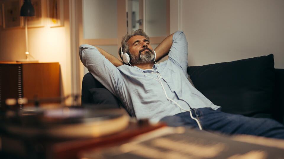 Mid,Aged,Man,Listening,Music,With,Headphones,On,Phonograph,,Relaxed