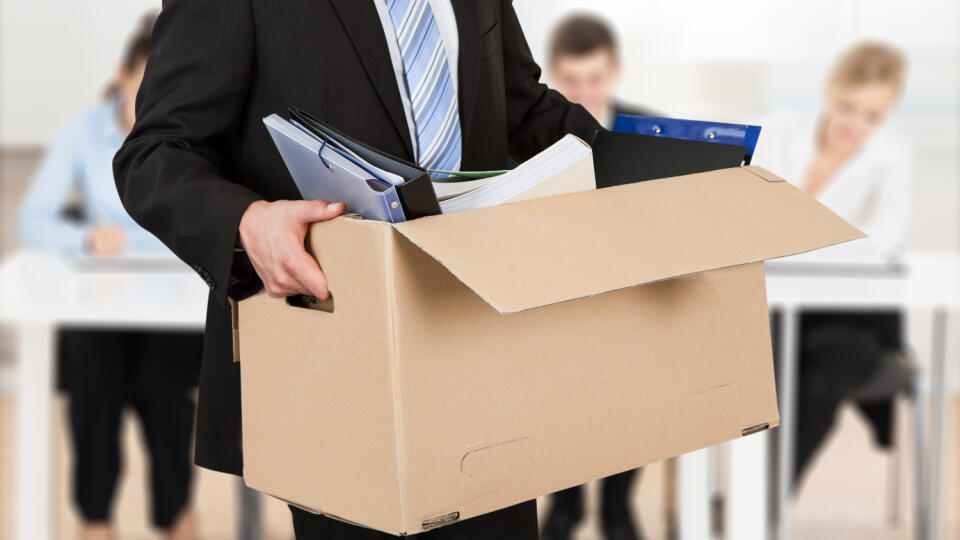 Close-up Of A Businessperson Carrying Cardboard Box During Office Meeting