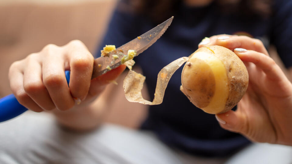 Girl,Peeling,Boiled,Potatoes,With,A,Knife.,Cooking,Food