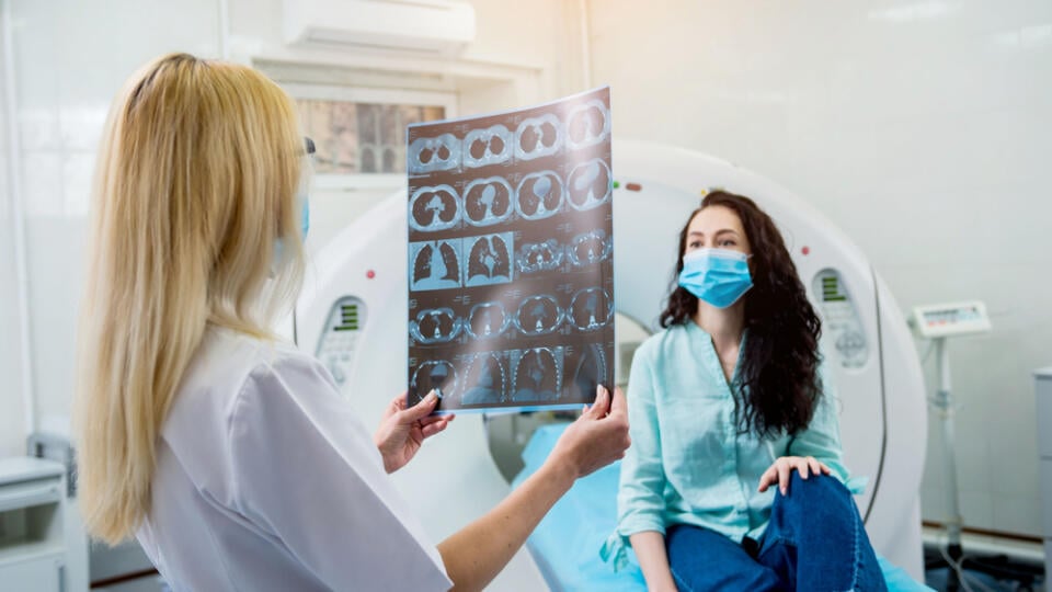 Radiologist,With,A,Female,Patient,Wearing,Protective,Masks,Examining,A