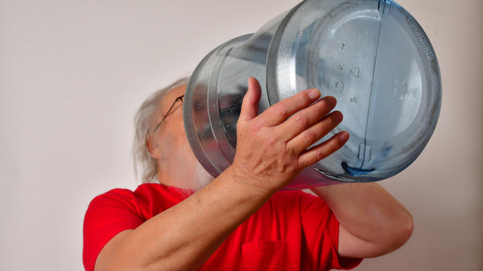 Old,Man,Drinking,From,A,5,Gallon,Water,Bottle.,Thirsty