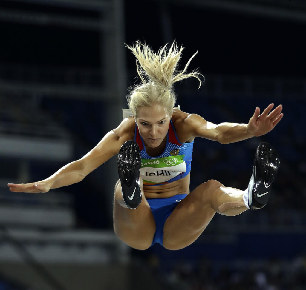 Russia's Darya Klishina makes an attempt in the women's long jump final during the athletics competitions of the 2016 Summer Olympics at the Olympic stadium in Rio de Janeiro, Brazil, Tuesday, Aug. 16, 2016. (AP Photo/Matt Slocum)