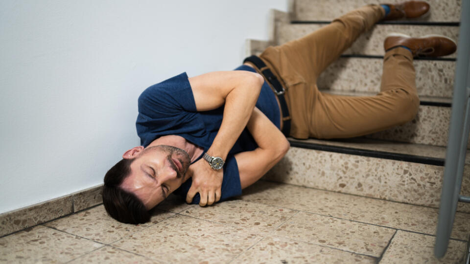 Unconscious,Man,Lying,On,Staircase,After,Slip,And,Fall,Accident