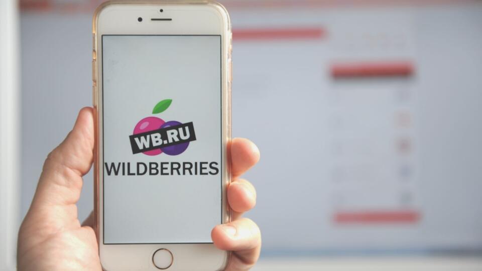 Human hand holding smartphone with Wildberries logo. Wildberries is the largest online store anв marketplace in Russia