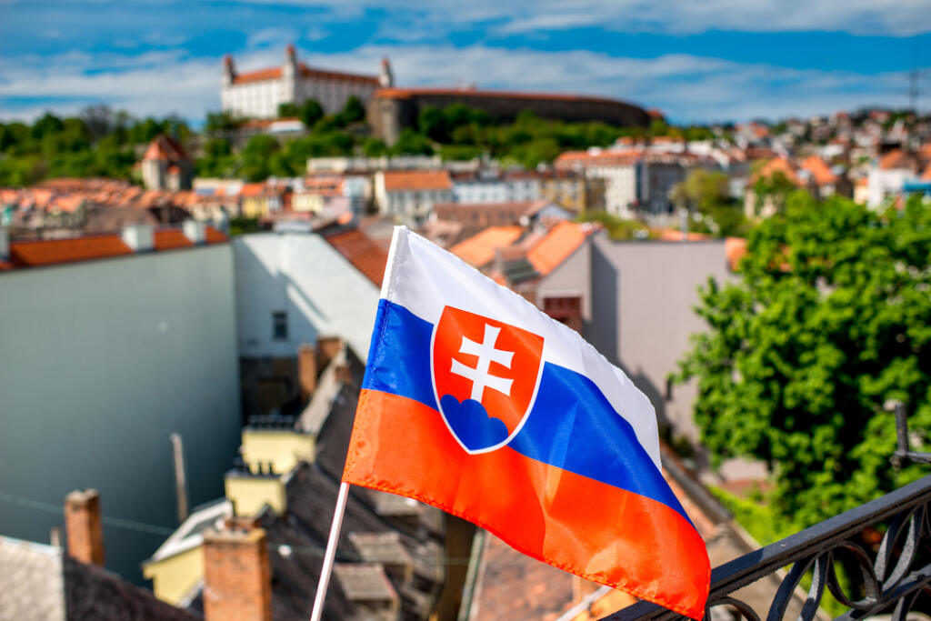 Slovak,Flag,On,The,Old,Town,Background,And,Bratislava,Castle