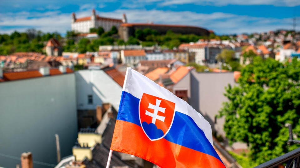 Slovak,Flag,On,The,Old,Town,Background,And,Bratislava,Castle