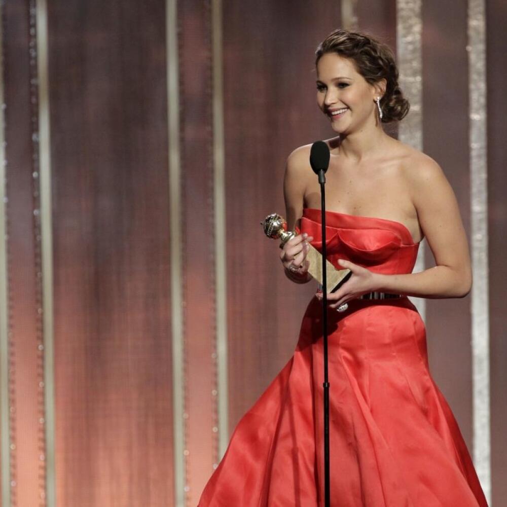 This image released by NBC shows actress Jennifer Lawrence with her award for best actress in in a motion picture comedy or musical for her role in