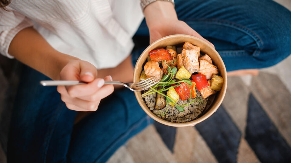 Girl,Holds,A,Paper,Plate,With,Healthy,Food,Sitting,On