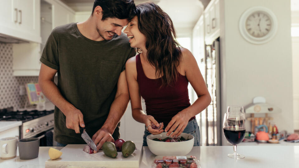 Loving,Young,Couple,Cutting,Vegetables,Together,At,Kitchen,Counter.,Young