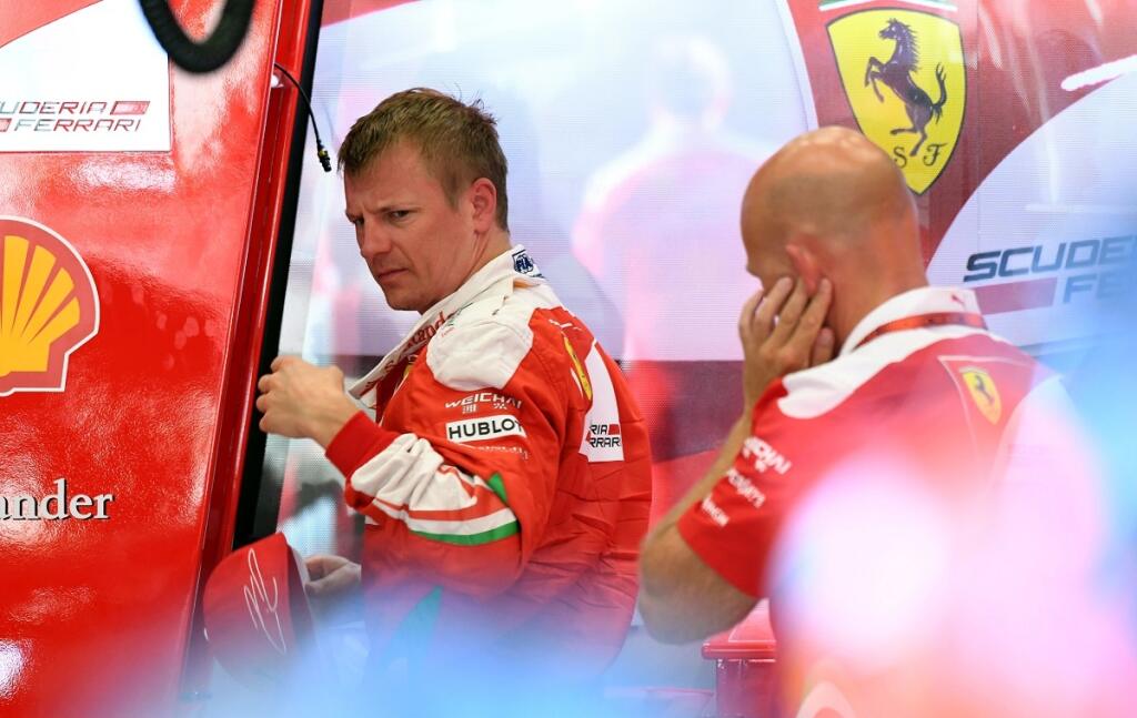 Ferrari driver Kimi Raikkonen of Finland walks in the pits during the first practice session at the Belgian Formula One Grand Prix circuit in Spa-Francorchamps, Belgium, Friday, Aug. 26, 2016. The Belgian Formula One Grand Prix will be held on Sunday. (AP Photo/Geert Vanden Wijngaert)