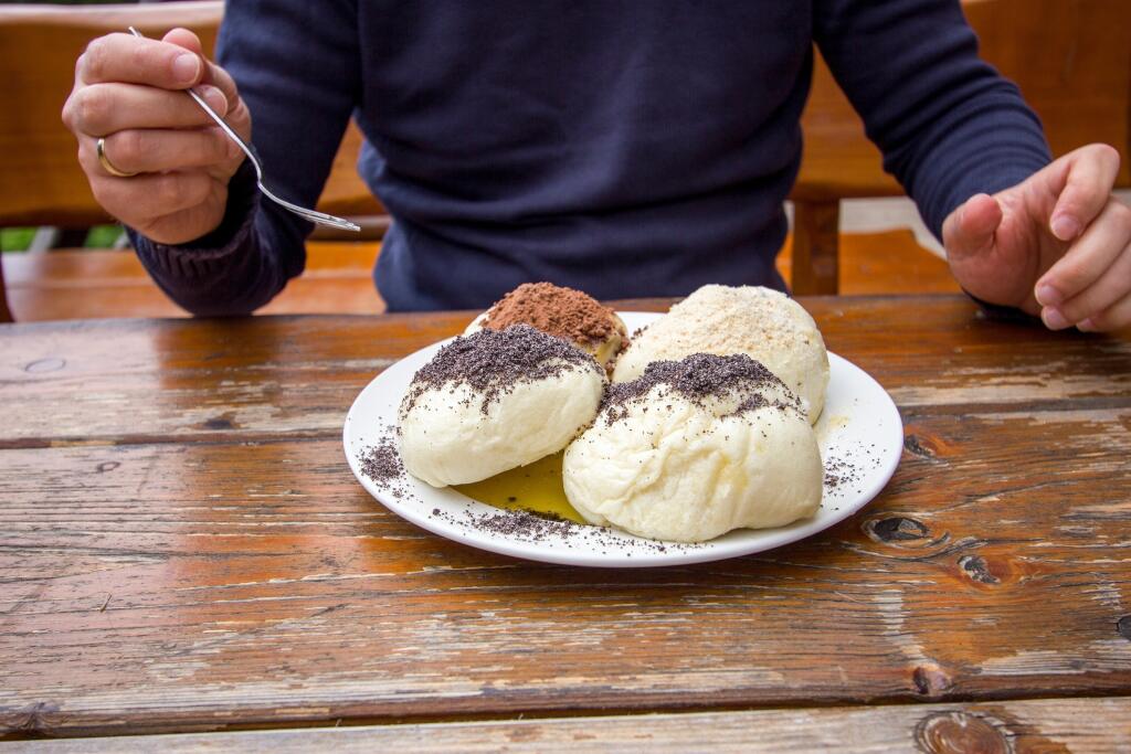 Plate of Four Steamed Dumplings Parene Buchty Pampuchy with Man Silhouette Ready to Eat