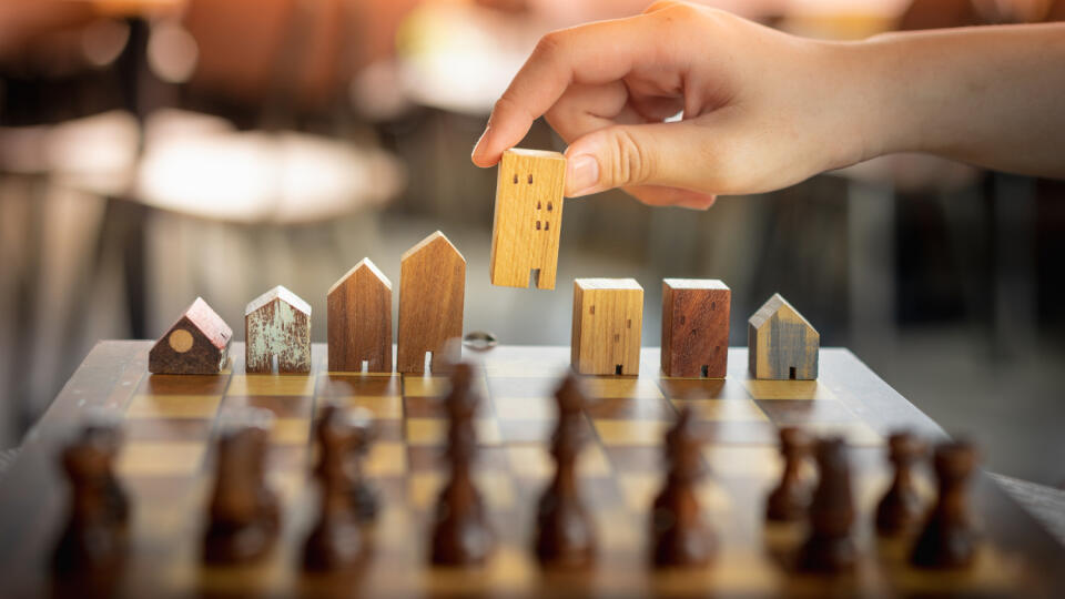 Building,And,House,Models,In,Chess,Game,,Business,Financial,District