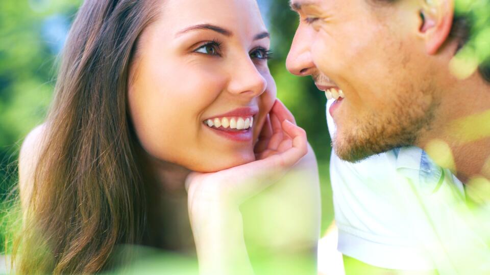 Attractive young couple gazing into each others eyes