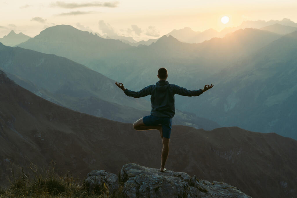 Young,Man,Practicing,Yoga.,He,Is,Stretching,And,Feels,Relaxed