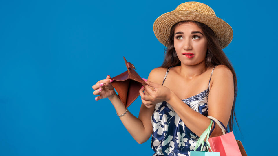 Portrait,Of,Unhappy,Young,Woman,Looking,In,Her,Wallet,In