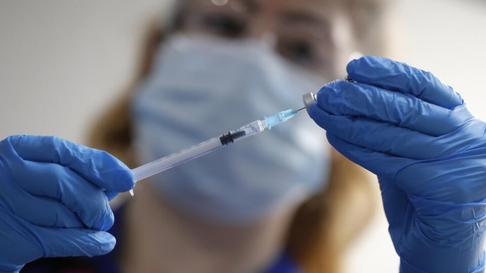 Pictured is a nurse with a Pfizer and Biontech vaccine against COVID-19 in the hospital.