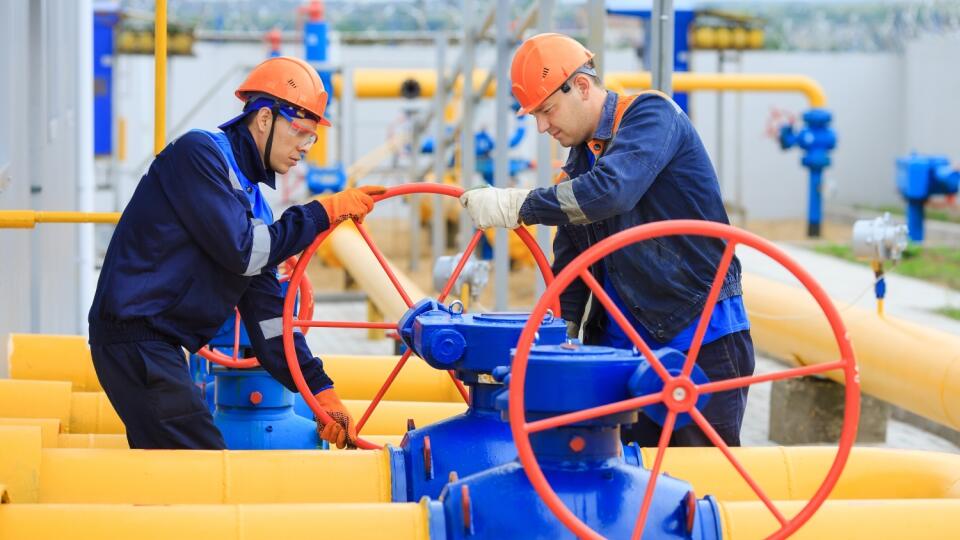 A,Uniformed,Worker,Opens,A,Valve,To,Control,Gases